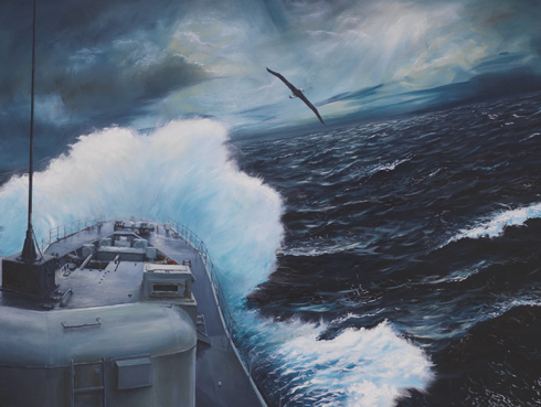 The Destroyer Escort crashes through the waves